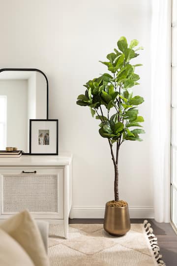 Kate and Laurel Fidmont 6ft. Faux Fiddle Fig Tree with Portell Antique Planter